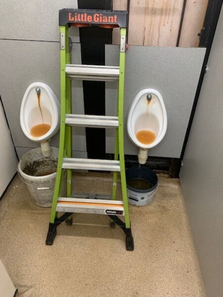 Factory urinals with traps removed during a commercial washroom repair in Bowthorpe, Norwich by EPH Services