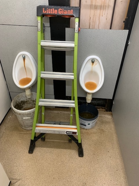 Factory urinals with traps removed during a commercial washroom repair in Bowthorpe, Norwich by EPH Services
