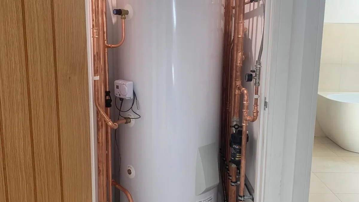 Panasonic air source heat pump cylinder installed in tight airing cupboard, Diss, Norfolk