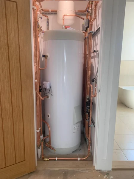 Panasonic air source heat pump cylinder installed in tight airing cupboard, Diss, Norfolk