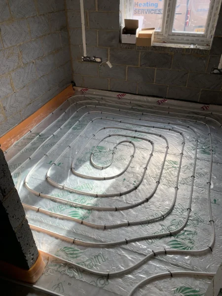 Underfloor heating pipes installed in spiral pattern in Great Moulton bungalow