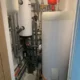 Completed airing cupboard with Panasonic Aquarea cylinder installation in Wymondham, Norfolk