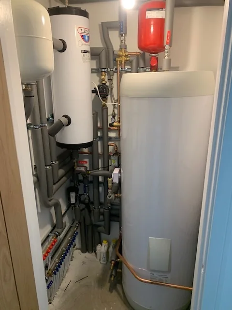 Completed airing cupboard with Panasonic Aquarea cylinder installation in Wymondham, Norfolk