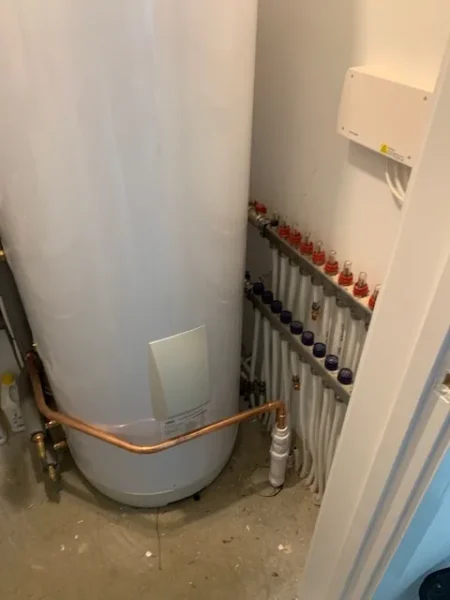 Completed Panasonic Aquarea heat pump cylinder cupboard pipework in Wymondham new build