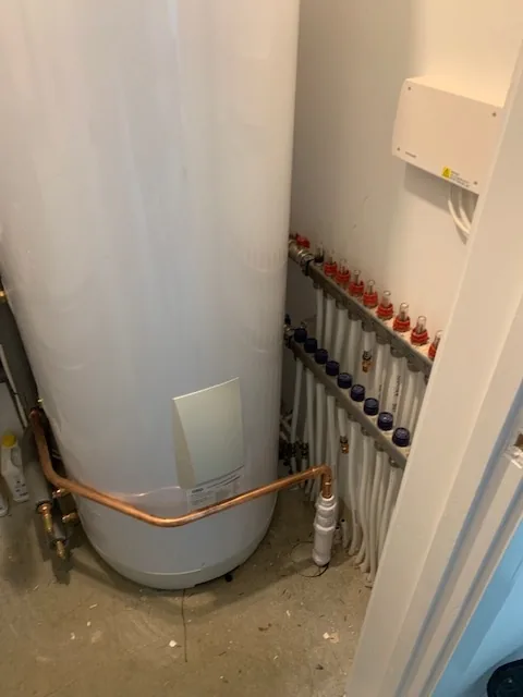 Completed Panasonic Aquarea heat pump cylinder cupboard pipework in Wymondham new build