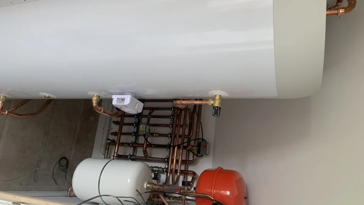 High gain air source heat pump cylinder installation with expansion vessels and pipework in Old Buckenham, Norfolk