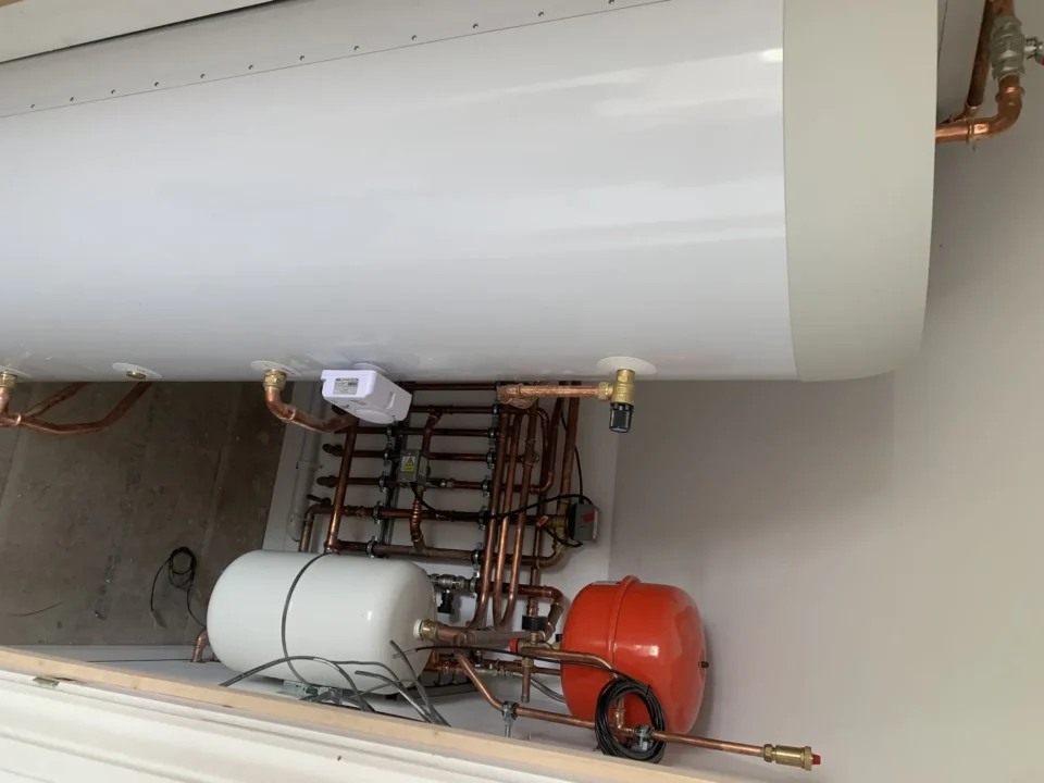 High gain air source heat pump cylinder installation with expansion vessels and pipework in Old Buckenham, Norfolk