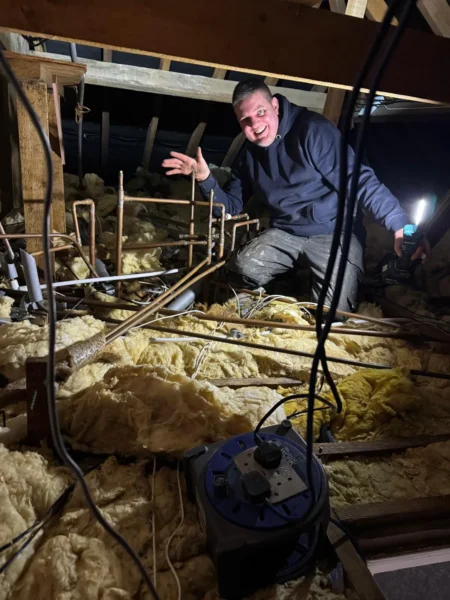 Plumber repiping loft space after frozen pipe damage in Necton Norfolk