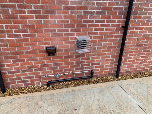 Worcester Bosch oil boiler installation external pipework and vent in Mileham Norfolk