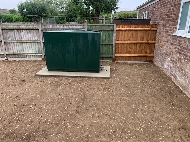 Green oil tank installation on concrete base Mileham Norfolk