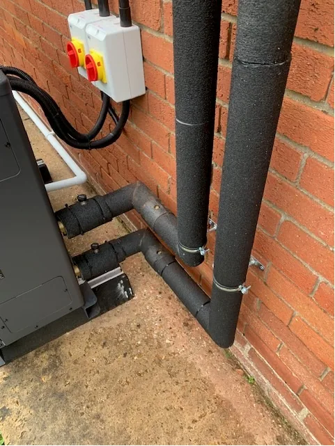 Panasonic heat pump pipework and isolation switch installation detail Shropham